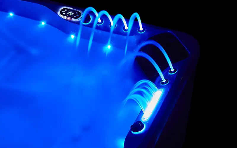 Samos-04 Lavatrice idromassaggio con luci LED blu, funzione wellness e aromaterapia, ideale per relax in spa o piscina privata.