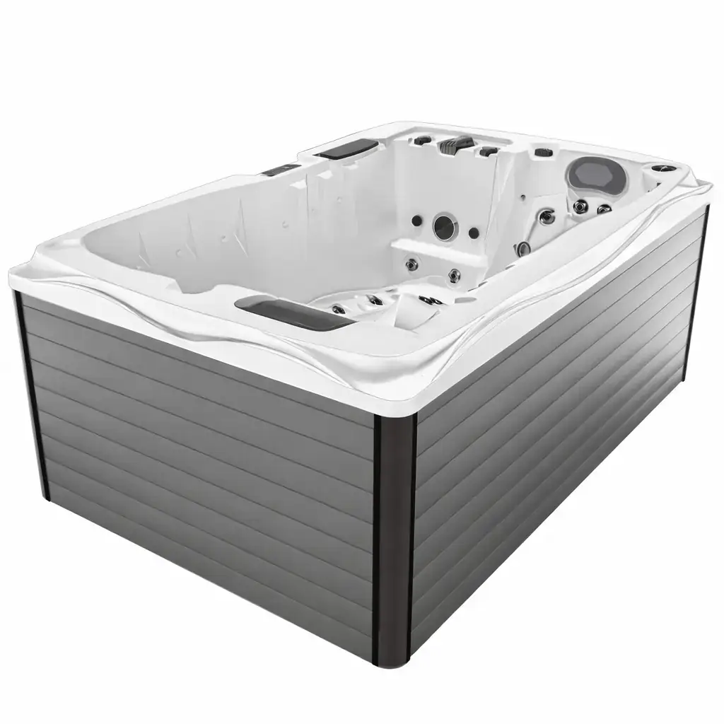 Vasca idromassaggio esterna in resina grigia con sedili e getti d'acqua Vasca idromassaggio esterna con sedili, getti d'acqua e pannello di controllo, in resina grigia, dimensioni compatte, ideale per relax e benessere in ambienti wellness.
